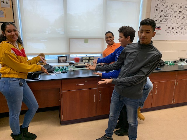 Students showing a clean lab station